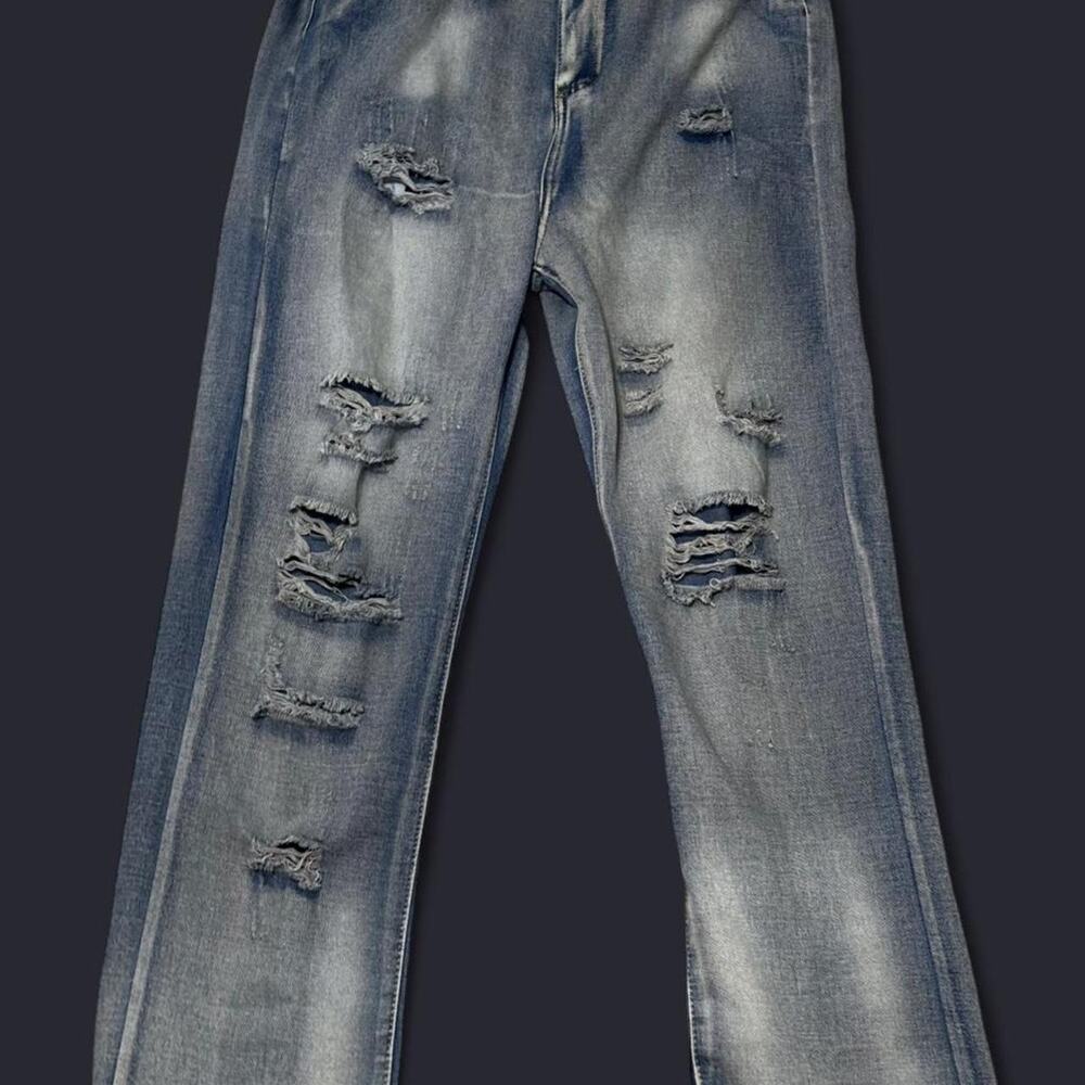 Distressed denim blue jeans